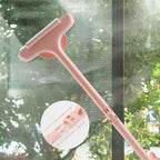 A person holding the blue and grey 2-in-1 Mesh Cleaning Brush, ready to clean a window.