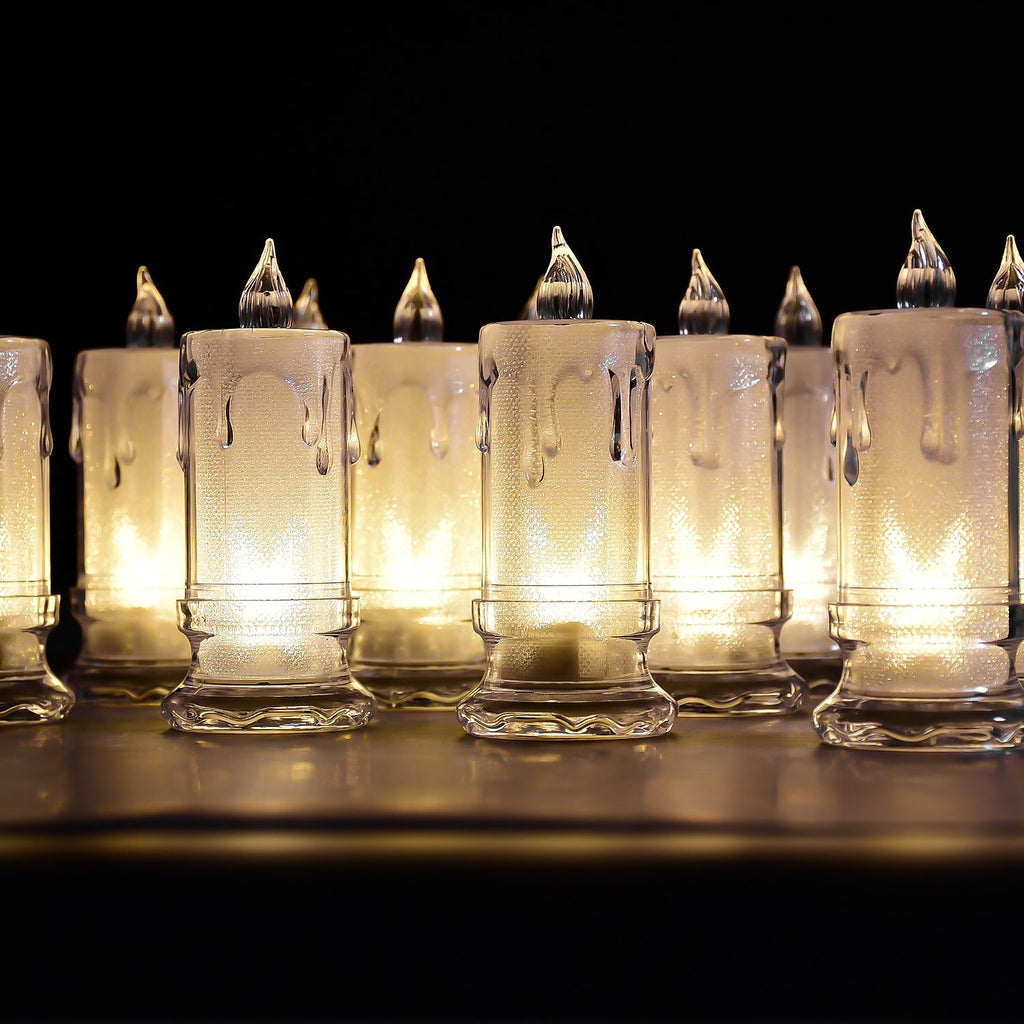 A charming group of Melted Design Flameless Candles casting a warm, inviting glow in a room setting.