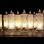 A charming group of Melted Design Flameless Candles casting a warm, inviting glow in a room setting.