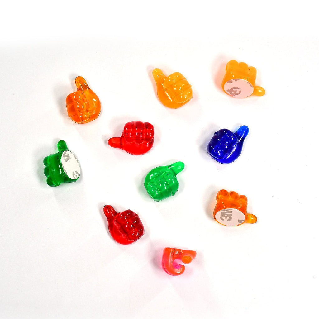 Assorted hand shape wall clips arranged to show their versatility as hangers.