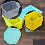 Stackable plastic fridge storage containers with ergonomic handles, organised in a refrigerator.