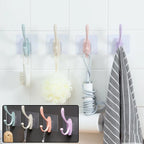 A versatile self adhesive wall hook installed on a kitchen tile, holding a towel.