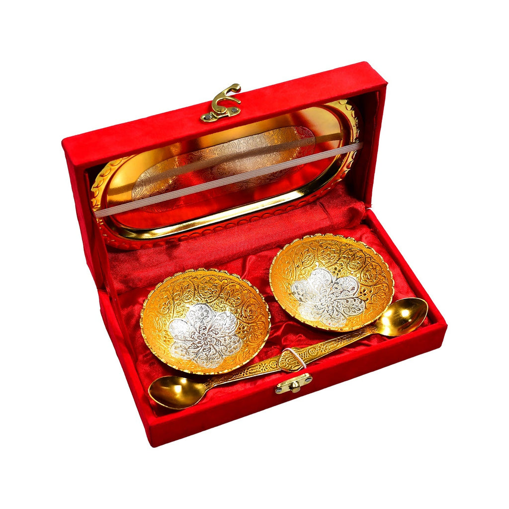Luxurious gold and silver plated brass dry fruit serving tray set nestled in a vibrant red velvet box.
