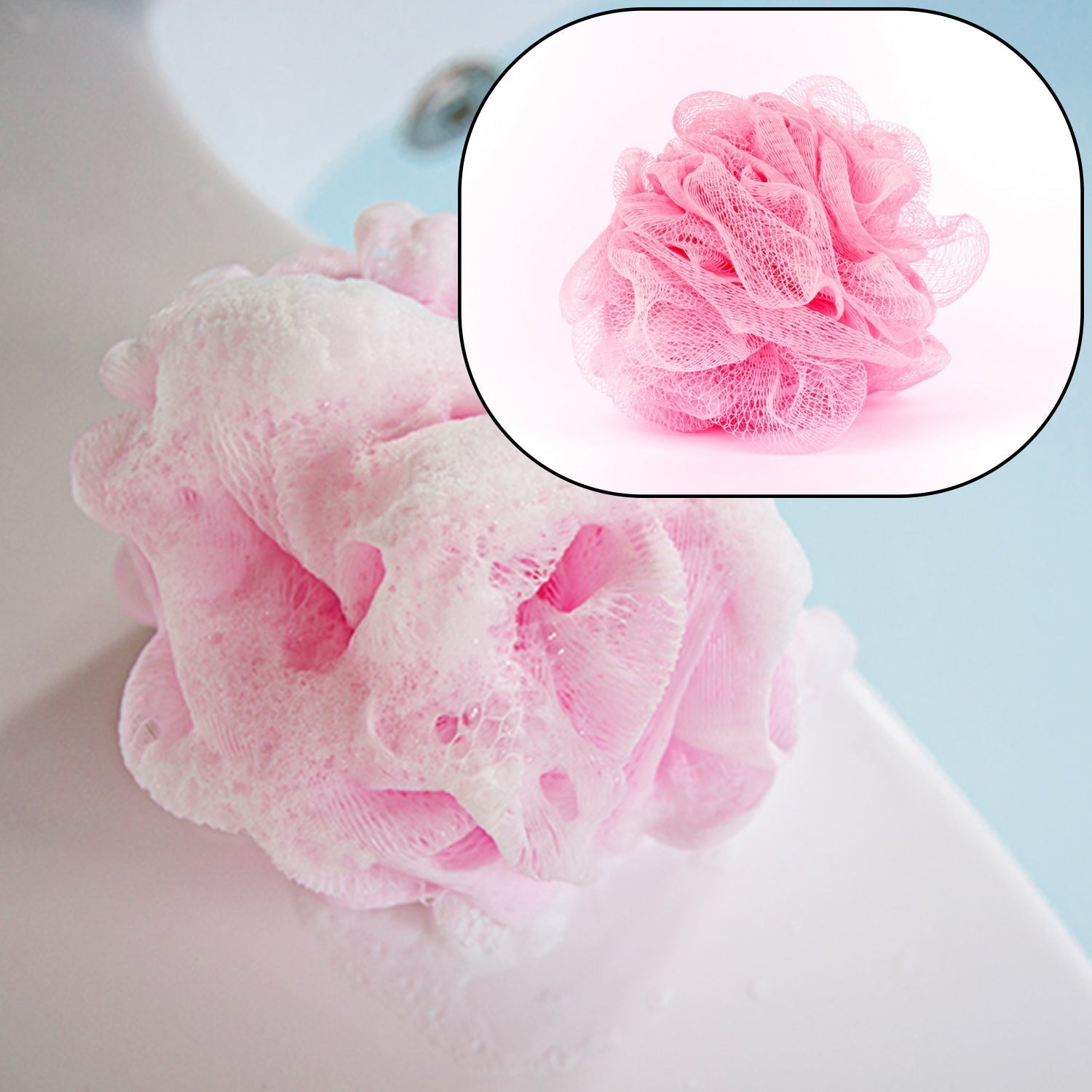 Hand holding a white bath loofah, ready for shower use.