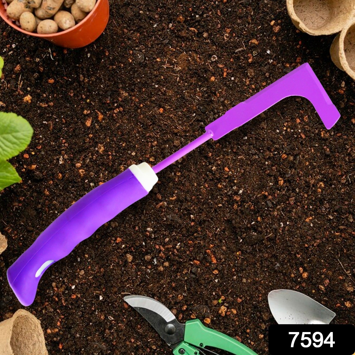 Transplanter tool from the kit, ideal for moving small plants and saplings.