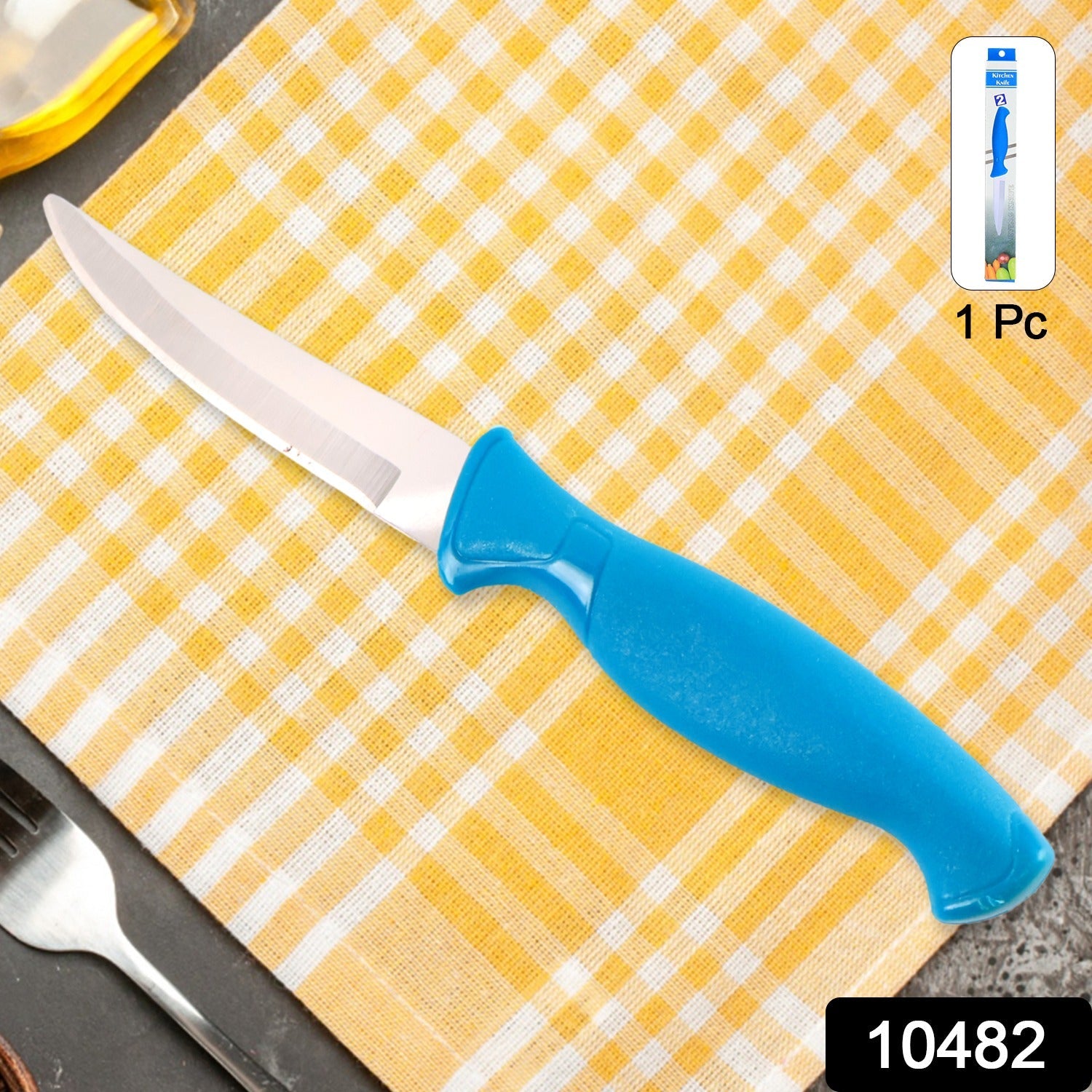 Sharp stainless steel kitchen knife laying flat on white background