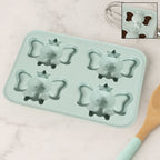 A flexible silicone cartoon ice cube tray with 4 grids, perfect for making mini ice cubes.