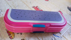 Top view of a cartoon printed pencil case with two organized compartments.