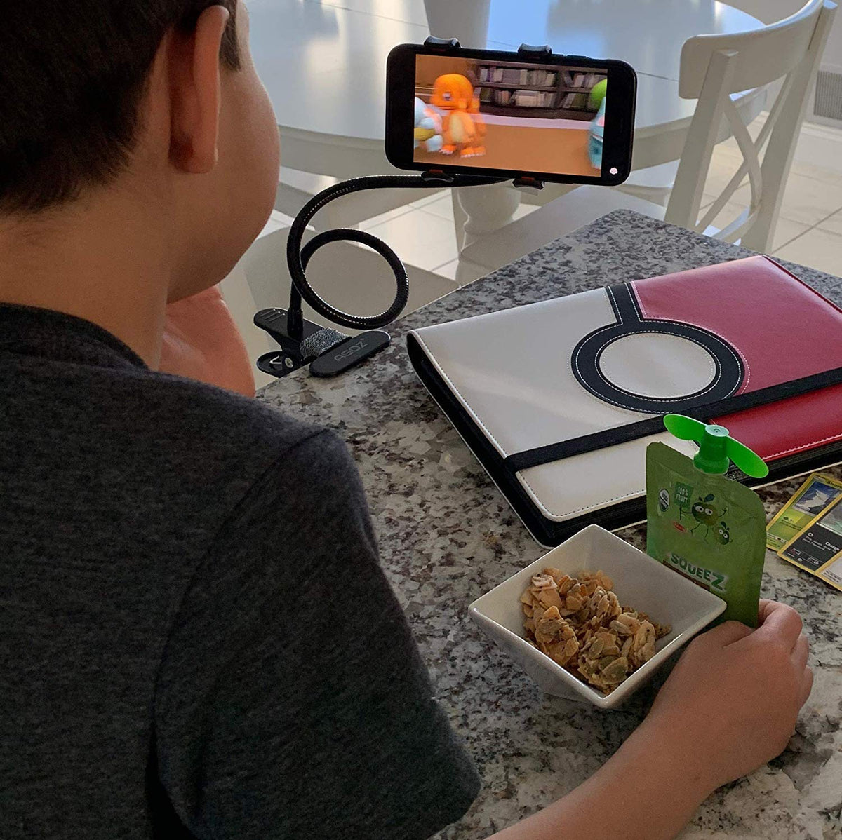 Flexible phone stand with 360-degree rotation for hands-free viewing.