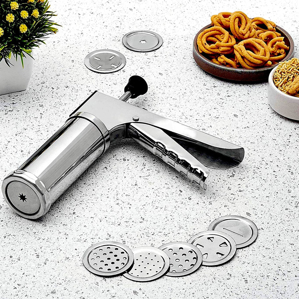 Stainless steel kitchen press with 15 interchangeable discs for making various Indian snacks.