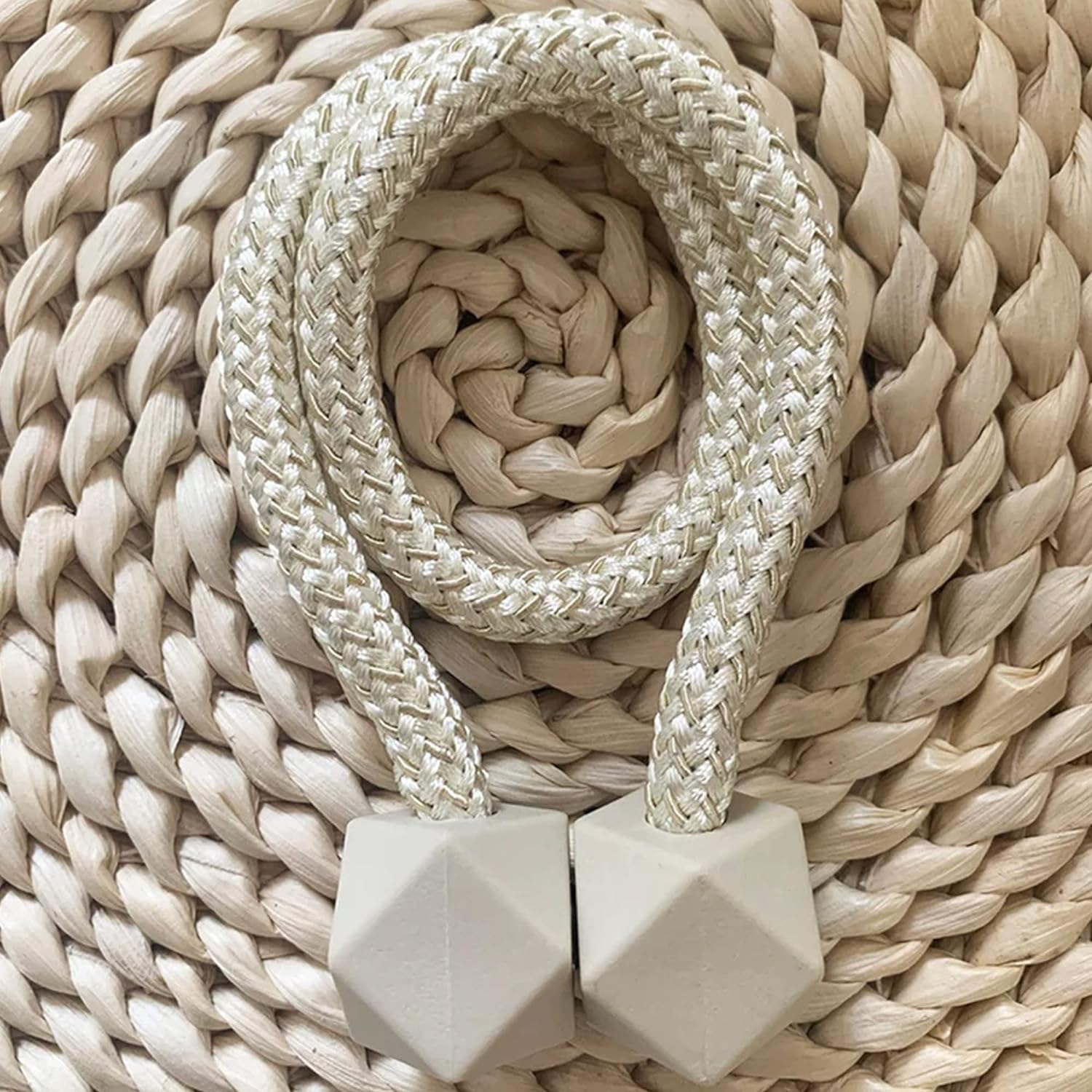 A pair of non-magnetic pearl curtain tiebacks displayed against a plain background.
