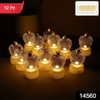 Close-up of apple shaped LED tealight candle glowing warmly