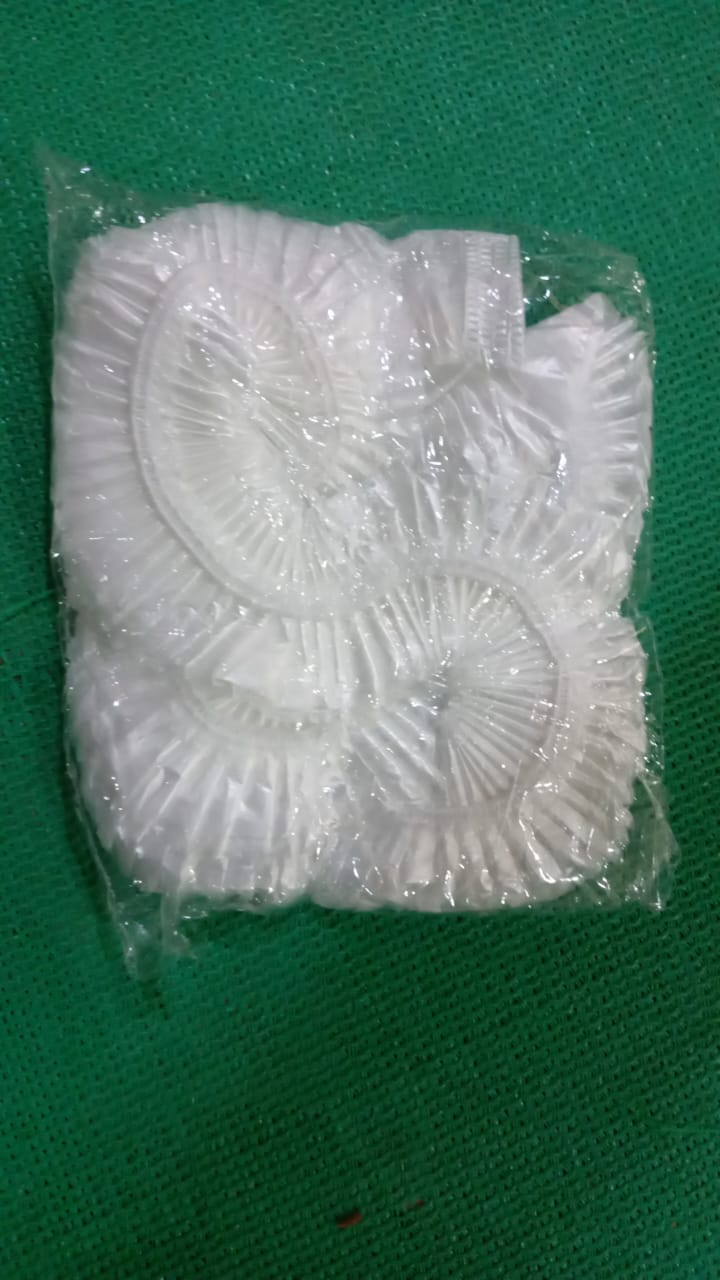 Large disposable dust cover applied to a set of furniture pieces.