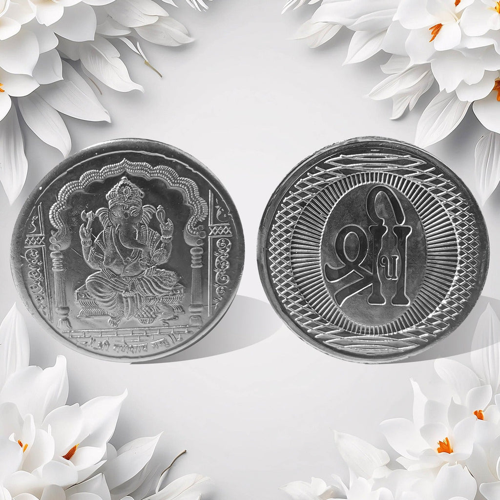 Hand holding the auspicious Decorative Ganesh Coin, ready for pooja or gifting.