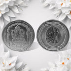 Hand holding the auspicious Decorative Ganesh Coin, ready for pooja or gifting.