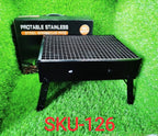 Siplix folding charcoal grill in use, cooking delicious food outdoors.