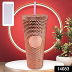 Person holding black studded tumbler showcasing ergonomic anti-slip grip