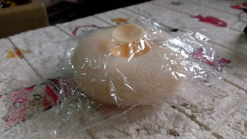 VelvaBloom flower bath sponge in its elegant packaging, ready for delivery.