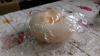 VelvaBloom flower bath sponge in its elegant packaging, ready for delivery.