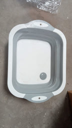 Dimensions of the foldable chopping board, illustrating its compact design.