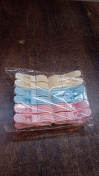 Colorful plastic cloth clips arranged neatly in rows for easy selection