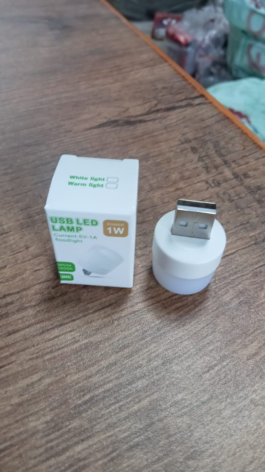 Overhead view of the compact USB LED night light, showcasing its design.