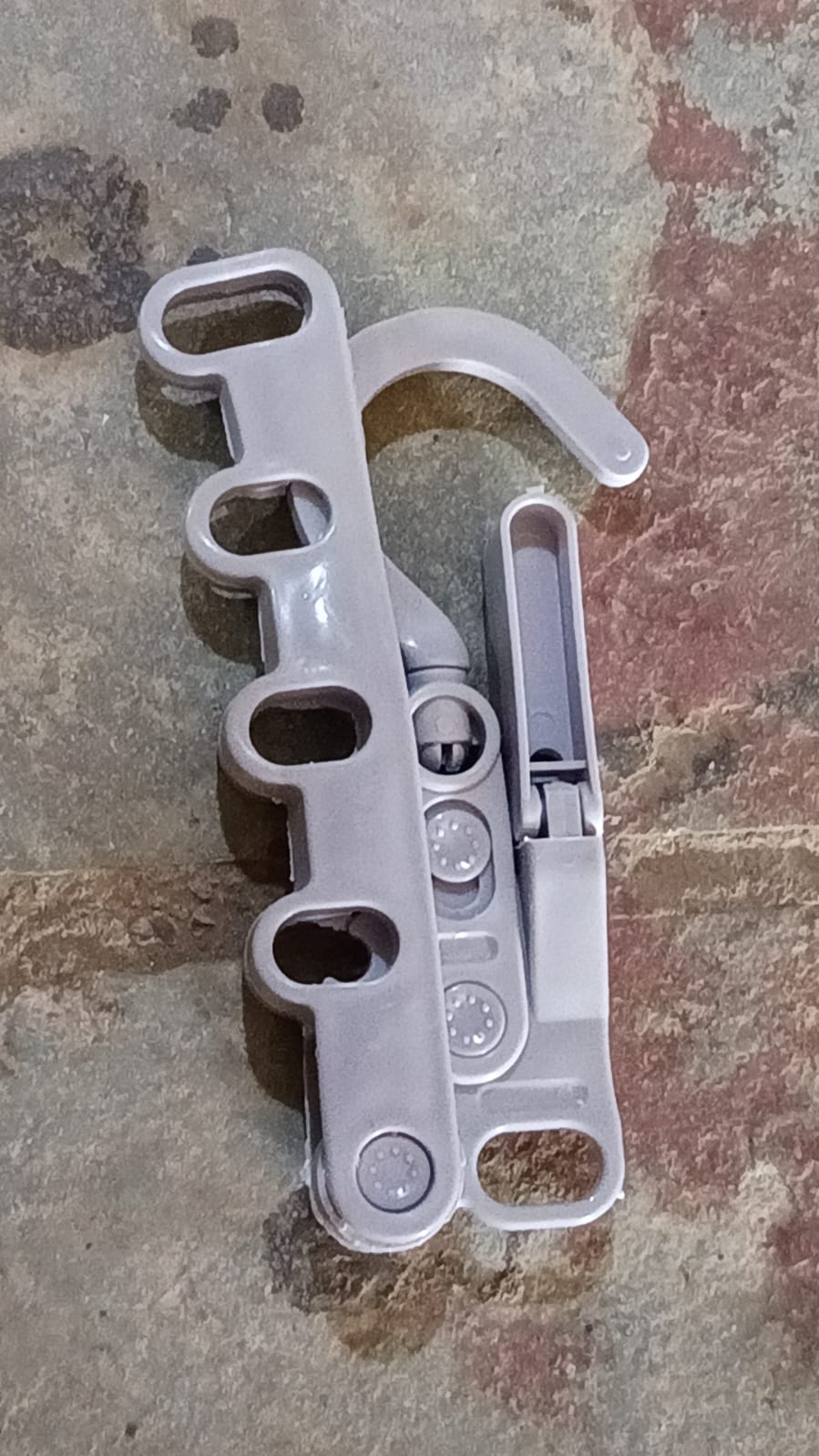 User hanging clothes on the space-saving 5-hole foldable hanger.