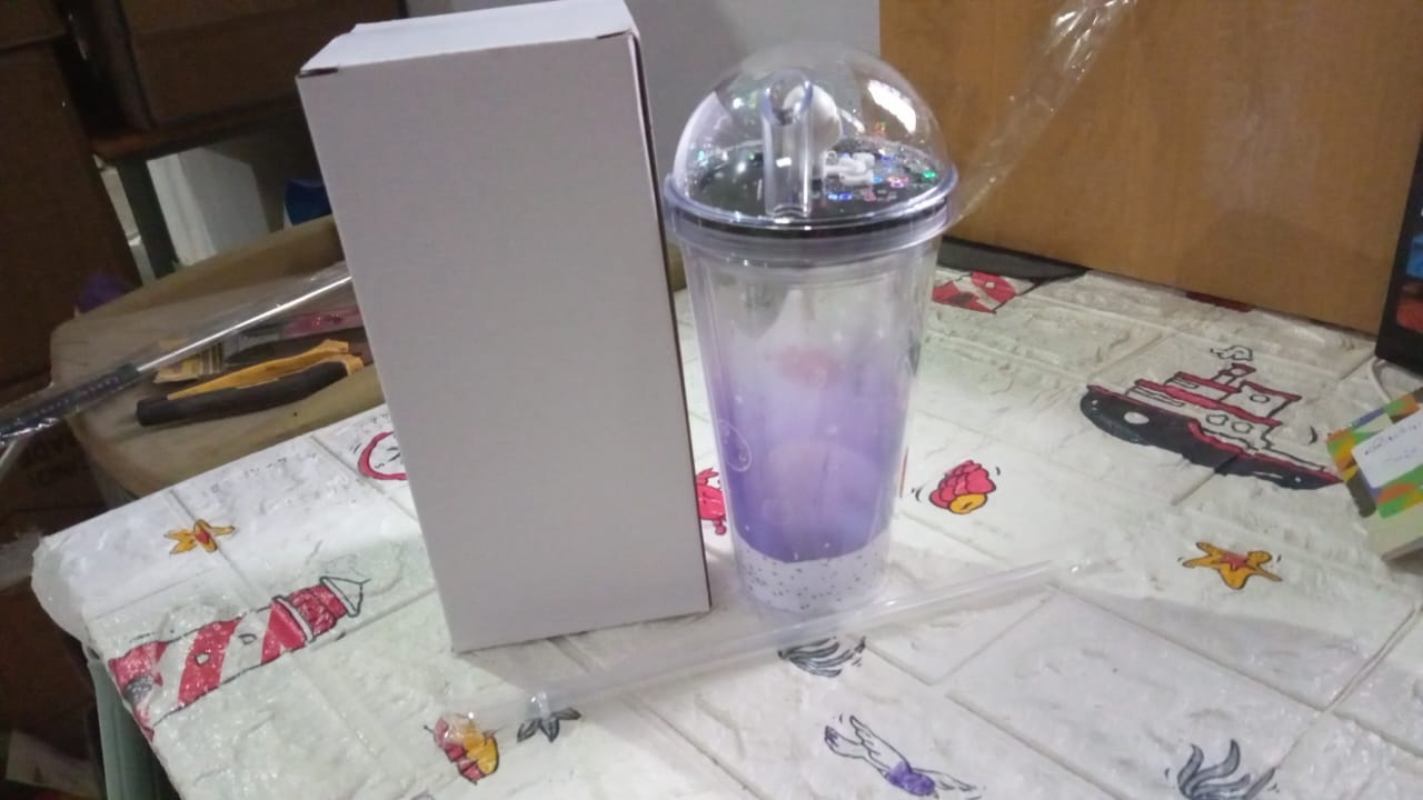 Insulated astronaut tumbler with an LED light and straw, designed for young space enthusiasts.