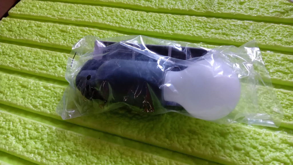 The practical hanging LED light providing instant illumination in a garage.
