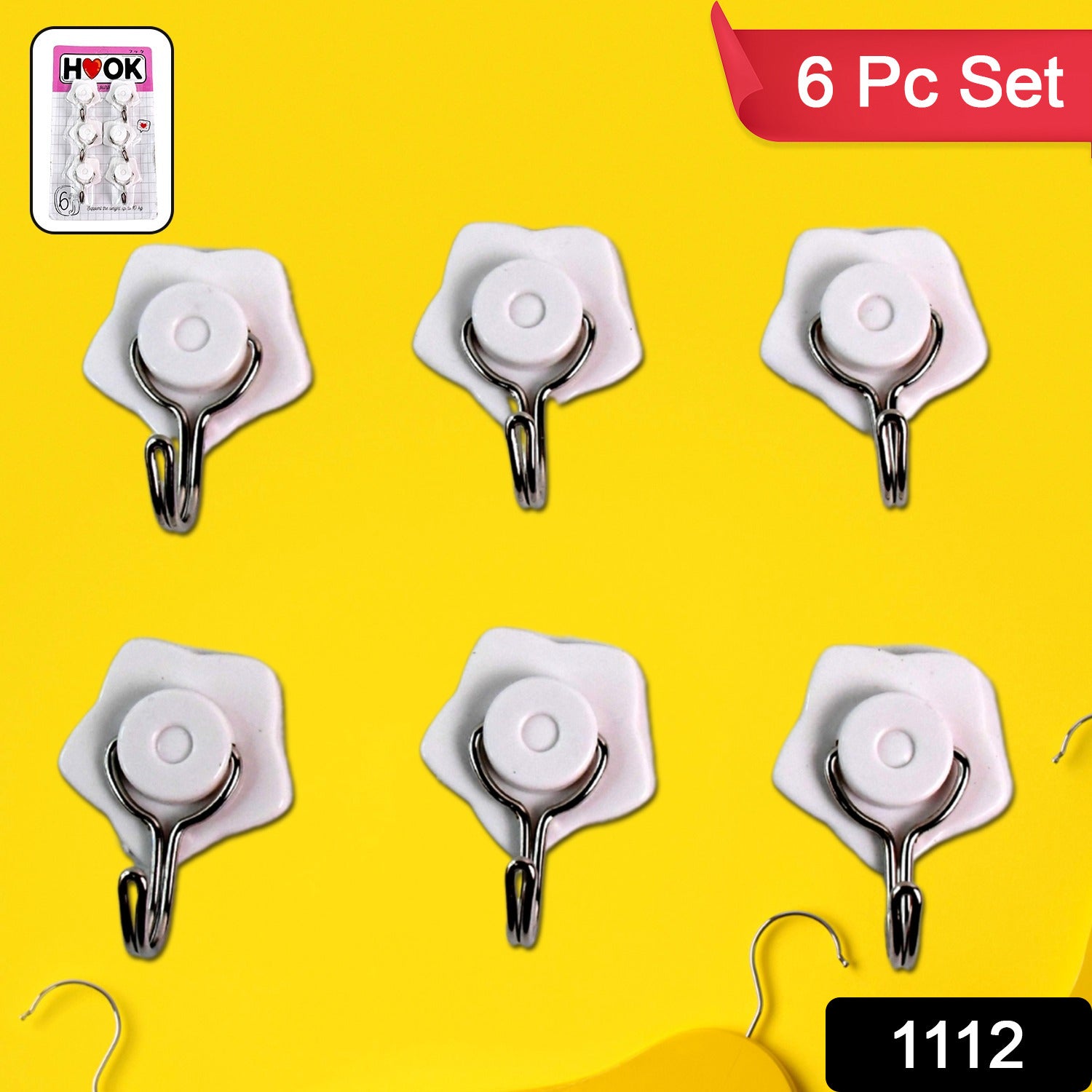 Multipurpose plastic wall hooks neatly organizing kitchen utensils on a tiled wall.