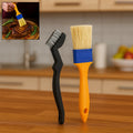 Two basting brushes, one with red handle and one with blue, for cooking and baking.