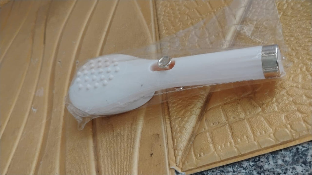 Person styling hair with self-cleaning anti-static detangling massage hairbrush