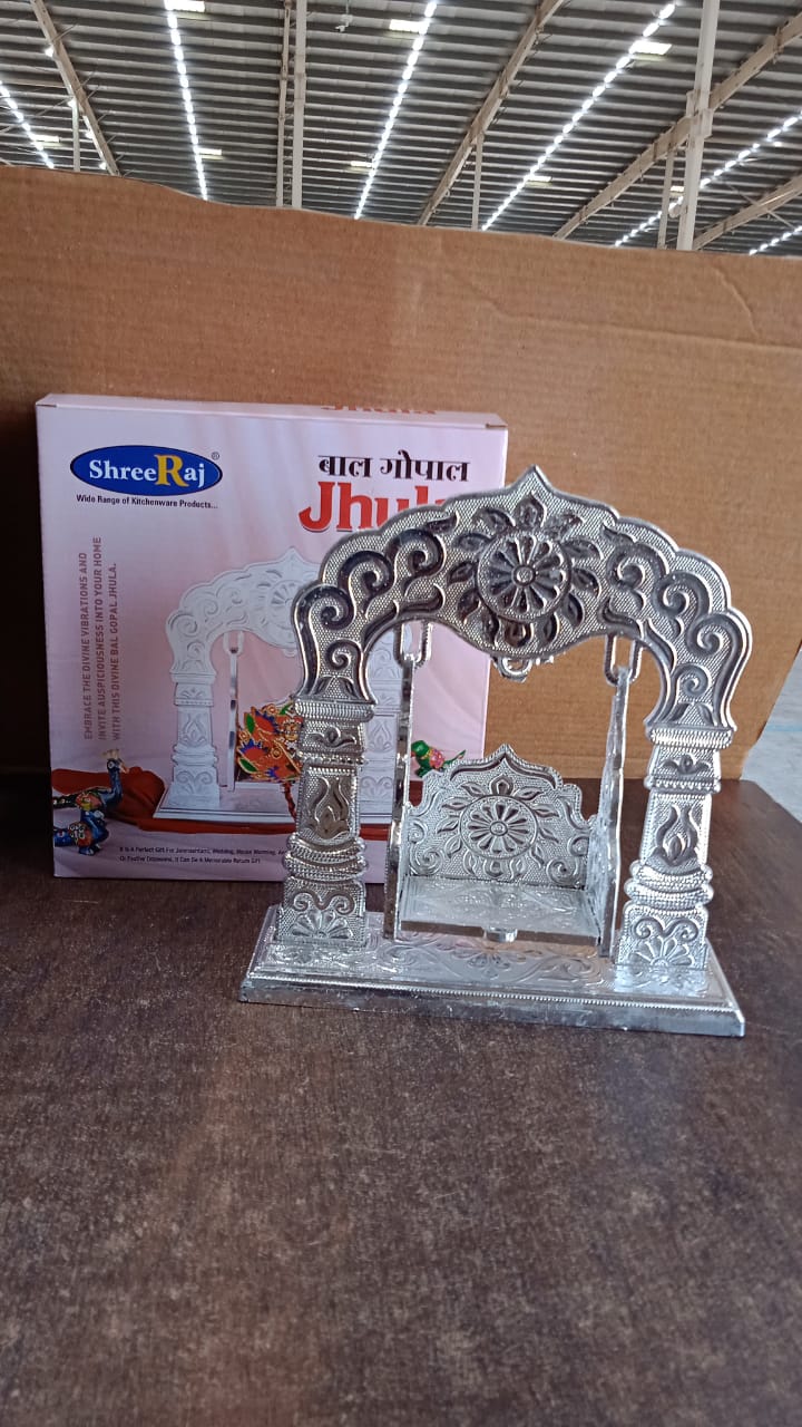 Handcrafted silver Bal Gopal Jhula swing displayed indoors for devotional use