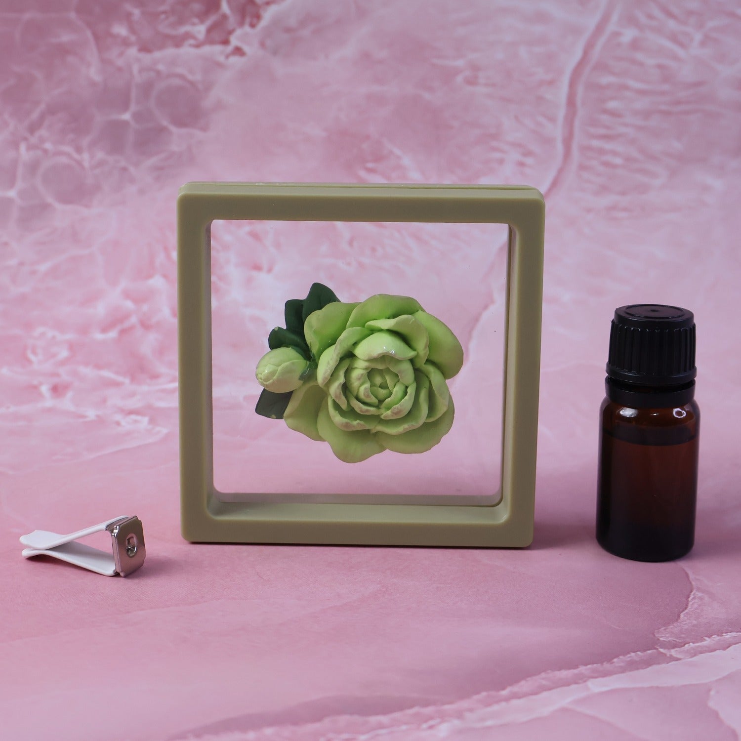 Angled view of stylish rose flower air freshener clip for AC vent