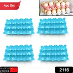 Stack of clear plastic egg trays, each holding 15 eggs, in a kitchen setting.