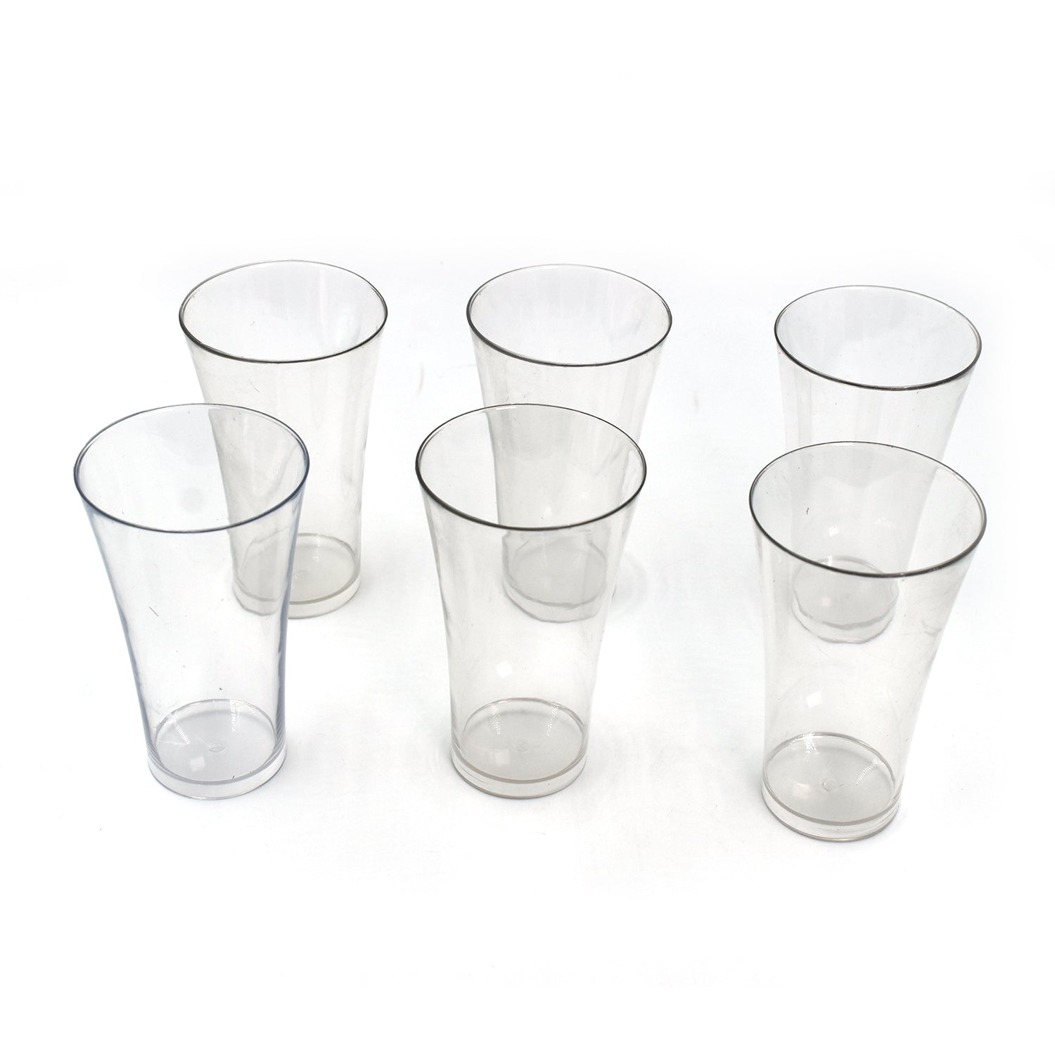 Transparent plastic drinking glasses filled with refreshing beverages.