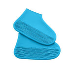 Silicone shoe covers neatly folded, highlighting their compact and portable nature.