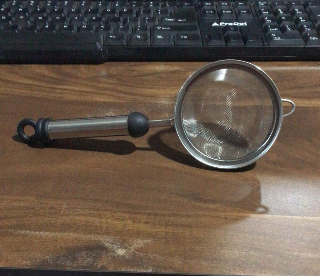 Rust-resistant stainless steel strainer with fine mesh for soups and juices.