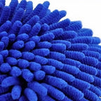 Microfiber Duster Mitt gently polishing silverware to a brilliant shine.