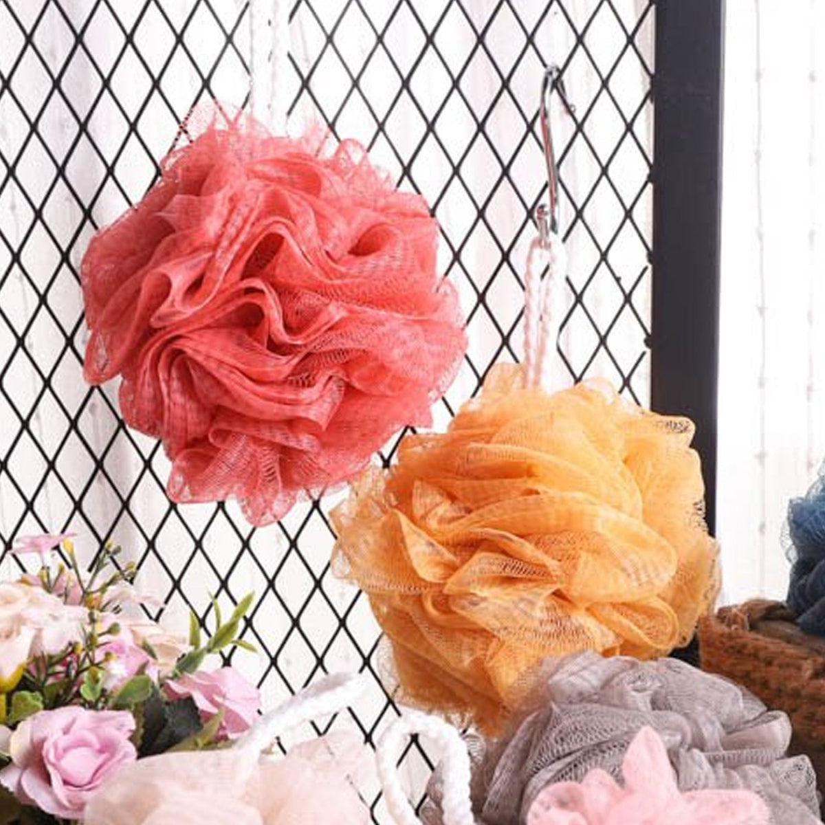 Soft round bath loofah for gentle body scrubbing.