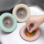 Silicone kitchen sink strainer basket neatly placed in a stainless steel sink.