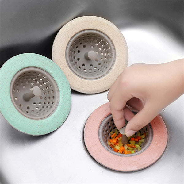Silicone kitchen sink strainer basket neatly placed in a stainless steel sink.