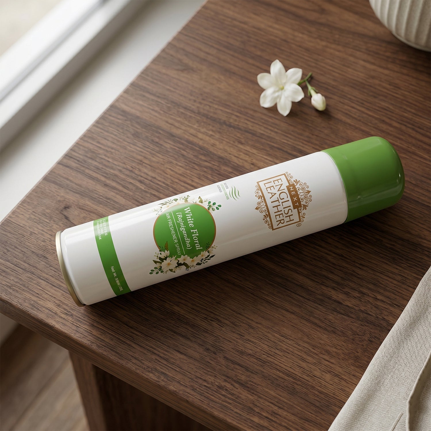 User spraying premium air freshener into indoor room for freshness