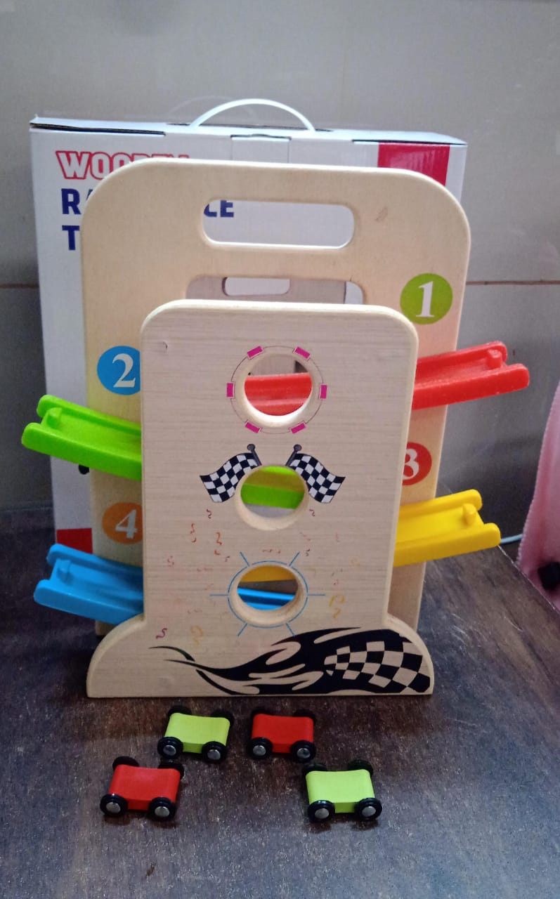 Portable Wooden Ramp Racer playset showing the convenient carry handle and cars.