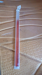 Close-up of transparent acrylic ruler with measurement scale