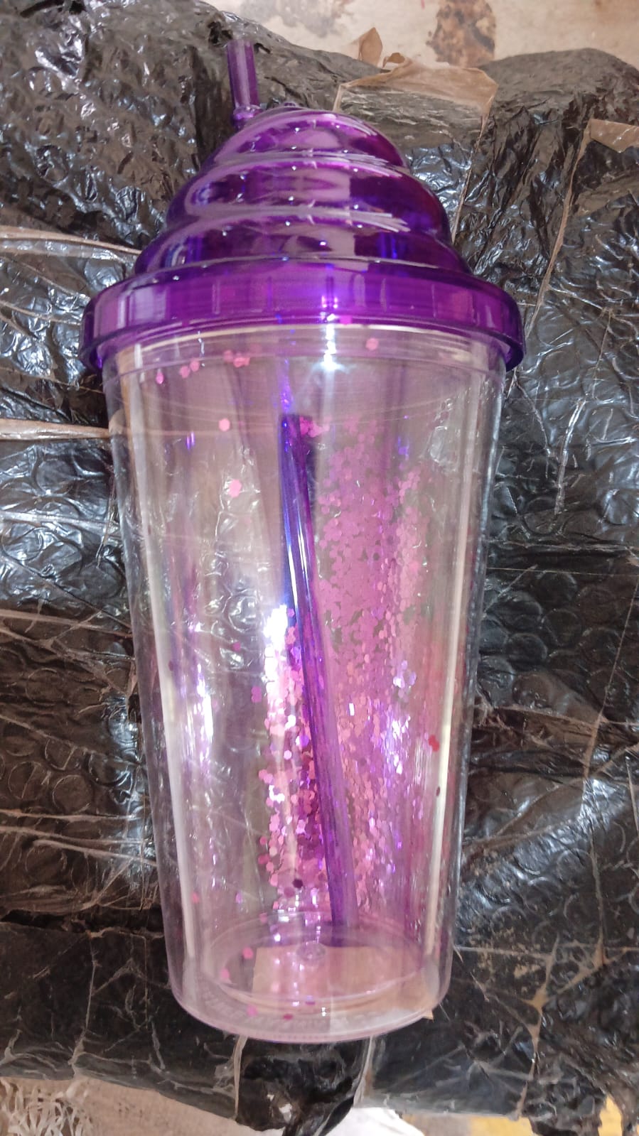 Durable plastic tumbler with lid and straw, perfect for gym, office, or outdoor activities.