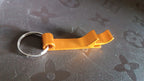 Angled view of stainless steel metal keychain with sleek look