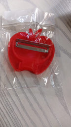 Retail packaging for the apple shaped folding vegetable peeler.