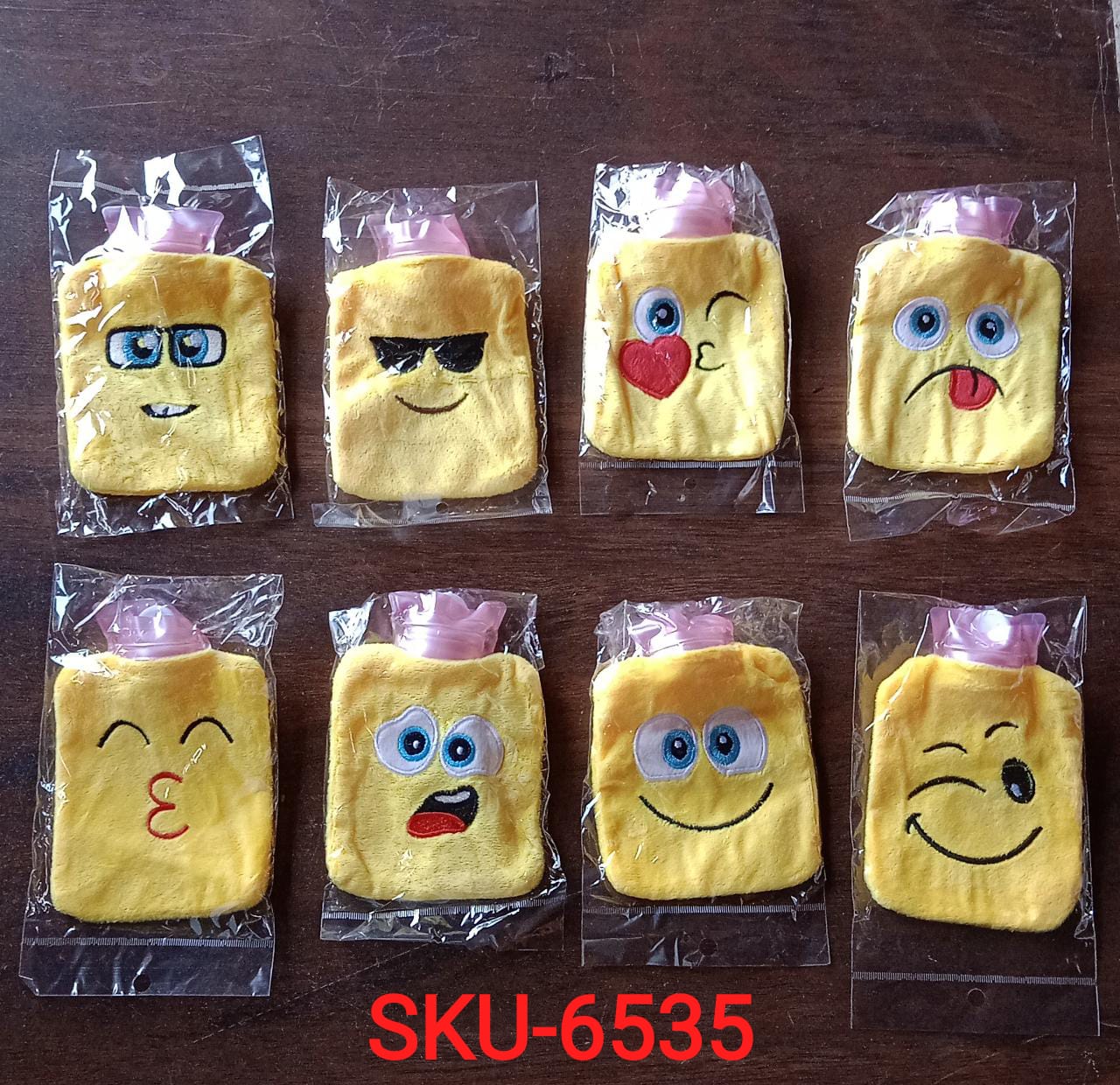 Top view of the emoji hot water bag, showcasing its secure cap and soft cover.