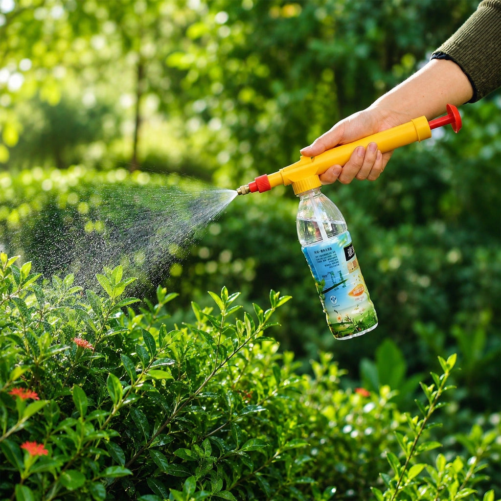 Bottle sprayer effectively used for watering plants in a garden setting.